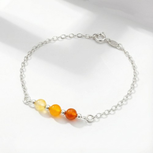 Srebrna bransoletka z naturalnym agatem pomarańczowym jasne srebro 925 zbliżenie na energetyczne kamienie