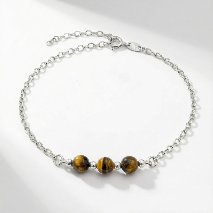 Srebrna bransoletka z naturalnym tygrysim okiem jasne srebro 925 zbliżenie na brązowe kule