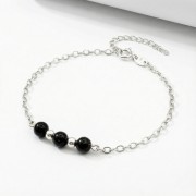 Srebrna bransoletka z naturalnym czarnym turmalinem jasne srebro 925 zbliżenie na czarne kule