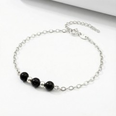 Srebrna bransoletka z naturalnym czarnym turmalinem jasne srebro 925 zbliżenie na czarne kule